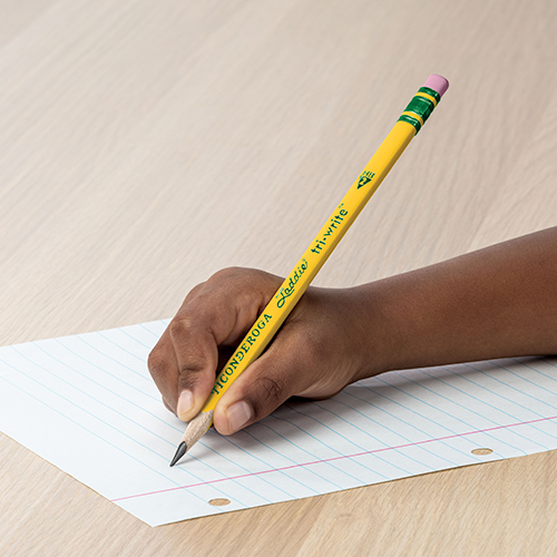 Kid writing with a pencil