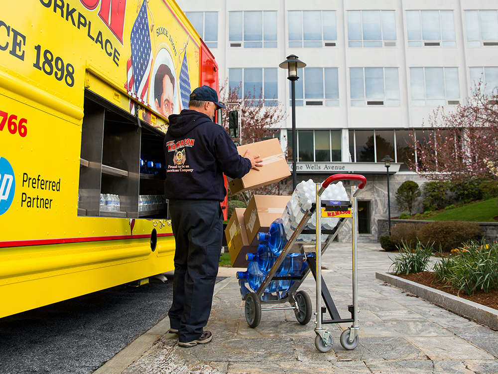 WB Mason Driver loading water on to a dolly
